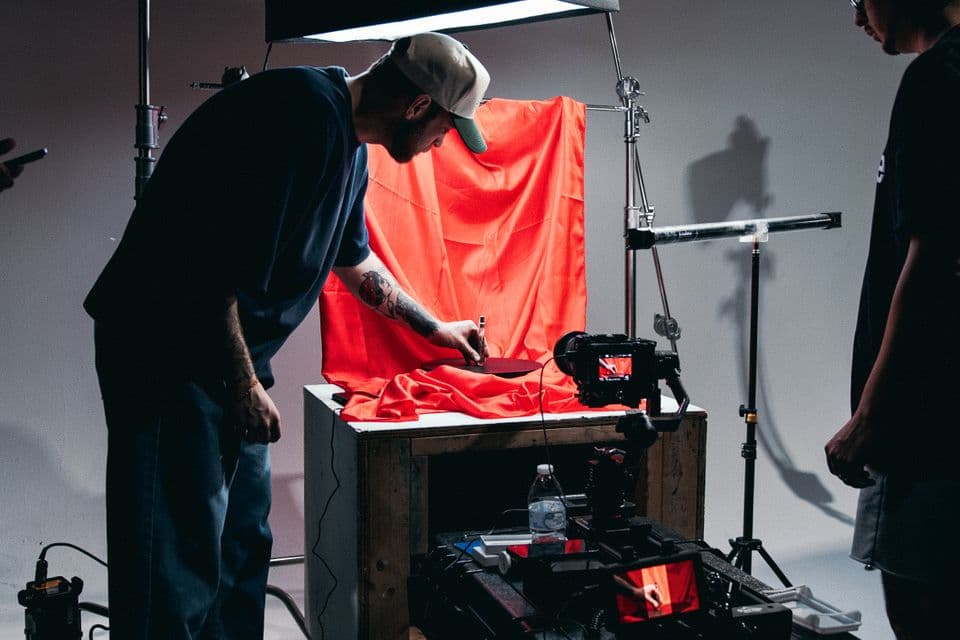 A crew dressing a set for a commercial shoot